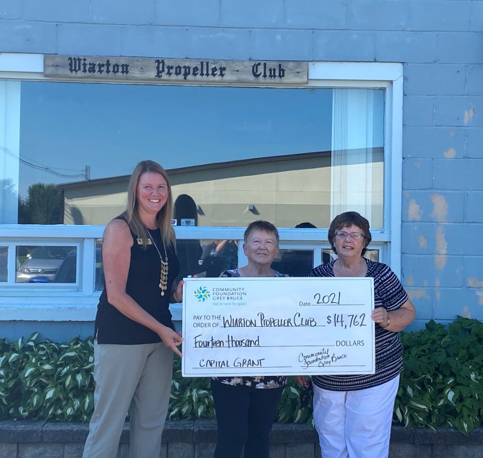 Jennifer presenting a check to the Wiarton Propeller Club