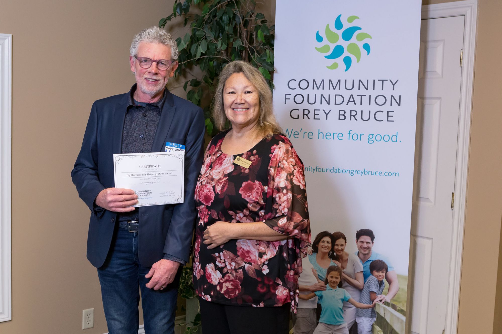 Andy McKee of Big Brothers Big Sisters accepts grant from CFGB Board member, Martha Pedoniquotte