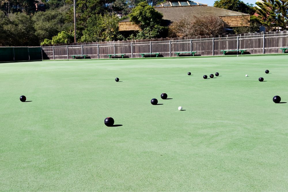 Lawn Bowling Balls Lie on the Grass